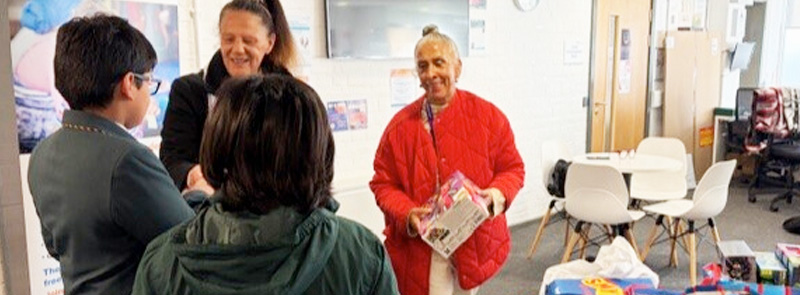 Adopted brothers make festive donation to city children 