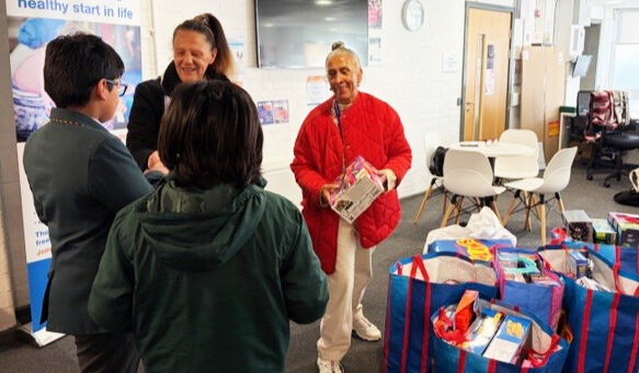Adopted brothers, ten and seven, have inspired their school friends to donate Christmas gifts to children in need, spreading holiday cheer in Wolverhampton.